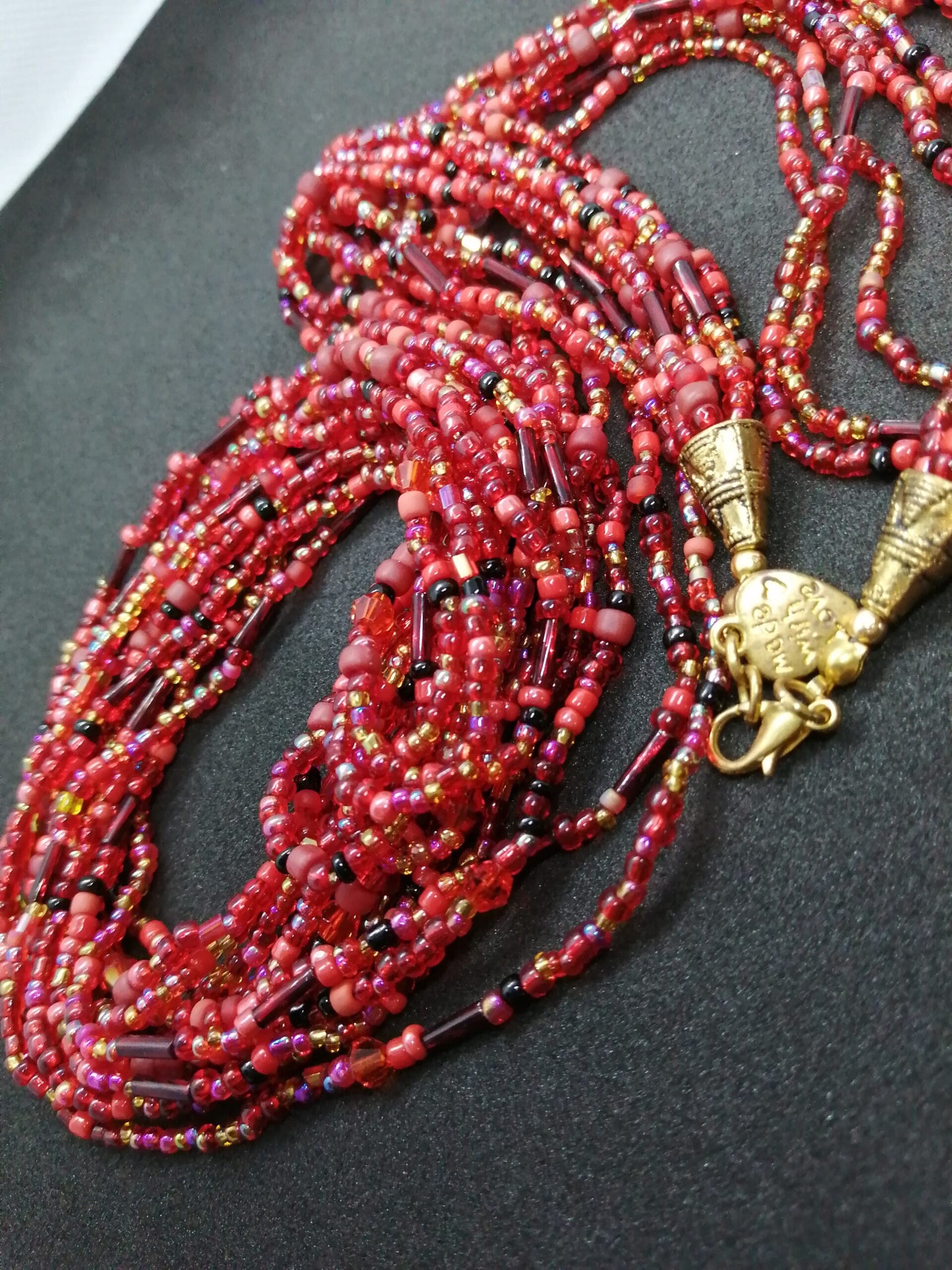 RED MULTI STRAND NECKLACE